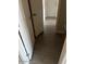 Hallway with wood floors and white doors at 5901 E Leonora St, Mesa, AZ 85215