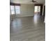 The living area with natural lighting and sliding glass door at 5901 E Leonora St, Mesa, AZ 85215