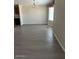 An open living area with a chandelier and a sunny bay window at 5901 E Leonora St, Mesa, AZ 85215