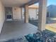 Inviting covered front porch with decorative rock landscaping and view of front yard at 6231 W Zoe Ella Way, Glendale, AZ 85306