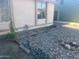 The side yard is xeriscaped with decorative rock landscaping and minimal plantings at 6231 W Zoe Ella Way, Glendale, AZ 85306