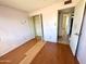 Smaller bedroom featuring bare walls and a compact closet space at 7961 W Campbell Ave, Phoenix, AZ 85033