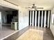 Alternative view of the living room area showcasing unique black-and-white design at 7961 W Campbell Ave, Phoenix, AZ 85033