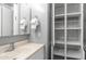 This bathroom features a vanity with an open cabinet, perfect for storing towels at 8103 E Southern Ave # 205, Mesa, AZ 85209