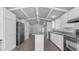 Open-concept kitchen featuring an island and a full suite of appliances at 8103 E Southern Ave # 205, Mesa, AZ 85209