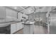 Bright kitchen with white cabinetry, island, and lots of natural light from the large window at 8103 E Southern Ave # 205, Mesa, AZ 85209