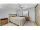 A serene bedroom with neutral walls and wood-look floors at 8103 E Southern Ave # 268, Mesa, AZ 85209