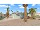 Exterior of the home surrounded by palm trees, gravel landscaping and bright blue sky at 8103 E Southern Ave # 268, Mesa, AZ 85209