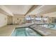Bright indoor pool and lounge area with hot tub perfect for year-round enjoyment and relaxation at 8103 E Southern Ave # 268, Mesa, AZ 85209