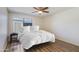 Bright bedroom with wood floors and a large window that brings in natural light at 8827 N New World Dr, Glendale, AZ 85302