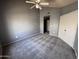 Bedroom with gray walls, neutral carpet, and closet featuring sliding doors at 9209 N 59Th Ave # 206, Glendale, AZ 85302