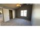 A bedroom with gray walls, carpeted floors, and a ceiling fan provides a cozy retreat at 9209 N 59Th Ave # 206, Glendale, AZ 85302