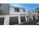 A townhome with an attached single-car garage and neutral-colored stucco exterior at 9209 N 59Th Ave # 206, Glendale, AZ 85302