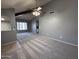 Living room featuring an open floor plan, breakfast bar, and view into the kitchen area at 9209 N 59Th Ave # 206, Glendale, AZ 85302