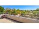 Outdoor balcony overlooking lush greenery with views of the neighborhood at 9843 E Acacia Dr, Scottsdale, AZ 85260