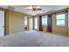 Bright and spacious bedroom with natural light, carpeted flooring, and neutral walls at 9843 E Acacia Dr, Scottsdale, AZ 85260