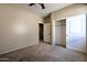 Carpeted bedroom with standard closet and a neutral color palette at 9843 E Acacia Dr, Scottsdale, AZ 85260