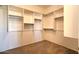 Spacious walk-in closet featuring custom shelving and ample storage space at 9843 E Acacia Dr, Scottsdale, AZ 85260