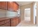 Hallway with custom cabinets and countertops, leading to other rooms in the home at 9843 E Acacia Dr, Scottsdale, AZ 85260