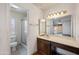 Well-lit bathroom featuring a shower, toilet, and vanity area at , Glendale, AZ 85302