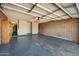 Spacious garage with a brick accent wall and ample room for parking and storage at , Glendale, AZ 85302