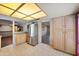 Spacious kitchen featuring natural wood cabinets, tile flooring, and stainless steel refrigerator at , Glendale, AZ 85302