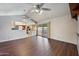 Open living room boasts wood laminate flooring and an open view to the kitchen and backyard at , Glendale, AZ 85302