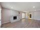 Spacious living room featuring a modern fireplace, wood floors, and access to the kitchen at , Glendale, AZ 85302