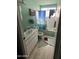 Bathroom with tiled tub and shower combination, with a Coors sign above the towel rack at 14839 N 29Th Dr, Phoenix, AZ 85053