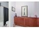 Chic bathroom boasting a large cabinet and tub with shower at 15953 W Custer Ln, Surprise, AZ 85379