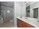 Bathroom featuring a large vanity and walk-in shower with round window at 15953 W Custer Ln, Surprise, AZ 85379