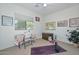 Versatile bedroom featuring a sewing space, trunk and large window at 15953 W Custer Ln, Surprise, AZ 85379