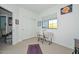 Well-lit room featuring a sewing area and ample space for activities at 15953 W Custer Ln, Surprise, AZ 85379