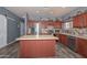Spacious kitchen featuring an island, stainless steel appliances, and ample cabinet space at 15953 W Custer Ln, Surprise, AZ 85379