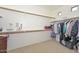 Spacious walk-in closet with ample shelving and hanging space for organized storage at 15953 W Custer Ln, Surprise, AZ 85379