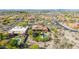 Backyard aerial view of luxurious desert home showcasing a lush yard and sparkling pool at 1607 W Pearce Rd, Phoenix, AZ 85041