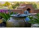 Close-up of a decorative water feature, enhancing the ambiance of the outdoor desert living space at 1607 W Pearce Rd, Phoenix, AZ 85041
