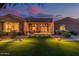 Expansive backyard featuring lush green grass, inviting patio space, and manicured landscaping at 1607 W Pearce Rd, Phoenix, AZ 85041