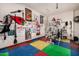 Alternate view of the home gym setup with workout equipment and sports memorabilia at 1607 W Pearce Rd, Phoenix, AZ 85041