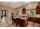 Open concept kitchen with large island, breakfast bar, and a scenic backyard view at 1607 W Pearce Rd, Phoenix, AZ 85041