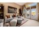 Comfortable living room featuring a sectional sofa, decorative pillows, and bright natural light at 1607 W Pearce Rd, Phoenix, AZ 85041