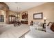Spacious living room with comfortable seating, elegant chandelier, and custom built-ins at 1607 W Pearce Rd, Phoenix, AZ 85041