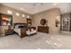 Expansive main bedroom with tray ceiling, neutral carpet, and recessed lighting at 1607 W Pearce Rd, Phoenix, AZ 85041