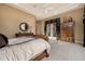 Comfortable bedroom featuring a tray ceiling and a doorway to the outside at 1607 W Pearce Rd, Phoenix, AZ 85041