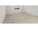 Neutral bedroom with plush carpeting, a window, and ample natural light at 17761 W Getty Dr, Goodyear, AZ 85338