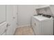 Functional laundry area with tile flooring and modern washer and dryer units at 17761 W Getty Dr, Goodyear, AZ 85338