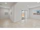 Bright living area with tile floors, recessed lighting, and a sliding glass door to the outside at 17761 W Getty Dr, Goodyear, AZ 85338