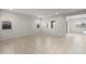 Spacious living room featuring neutral tile flooring and windows for abundant natural light at 17761 W Getty Dr, Goodyear, AZ 85338