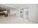 Open layout connecting the kitchen, living, and dining areas with access to the outdoor space at 17761 W Getty Dr, Goodyear, AZ 85338