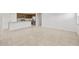Open concept living room with tile flooring and a view of the kitchen at 17761 W Getty Dr, Goodyear, AZ 85338